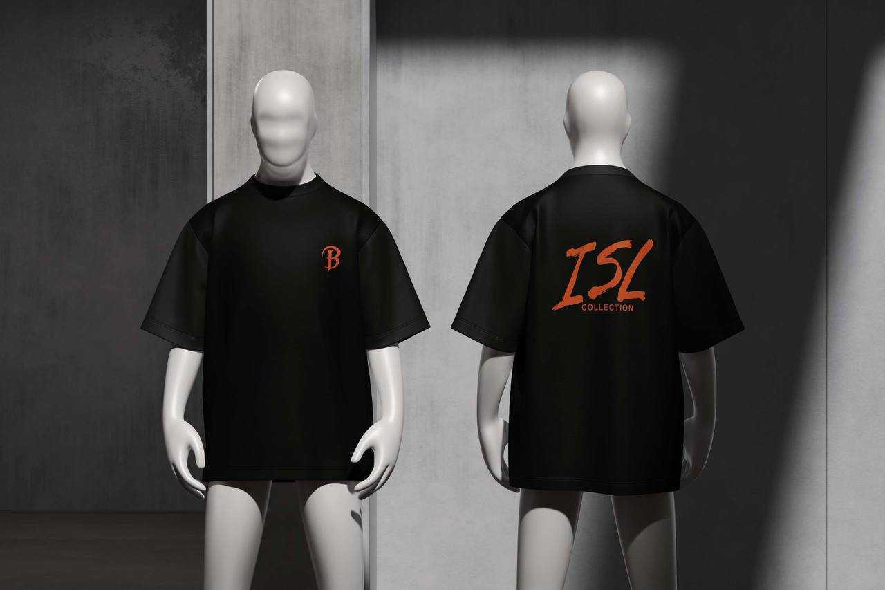 Black oversized tee with a rust orange B monogram at the chest and ISL COLLECTION printed across the back
